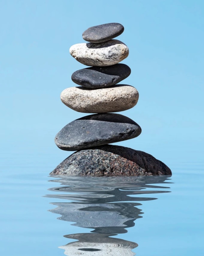 calming mood tile: stacked stones on blue water (tight)